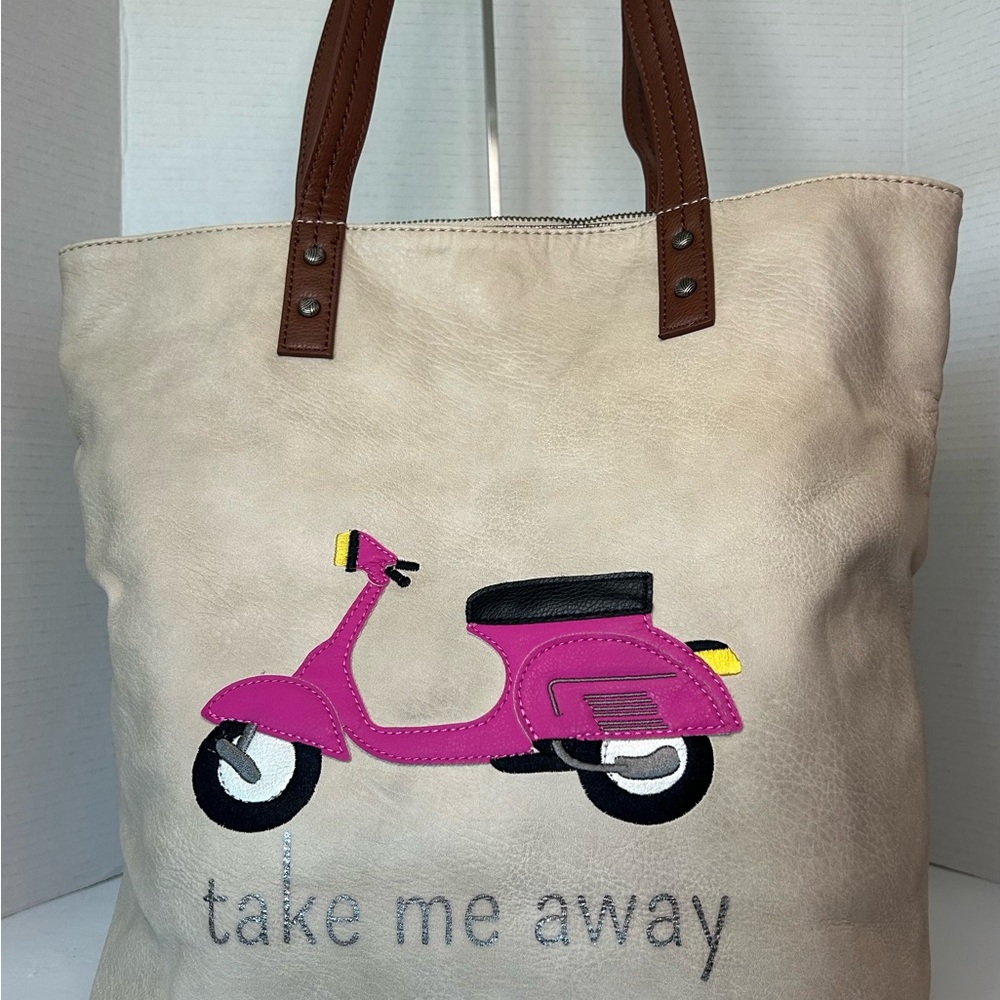 The Sak Cream Tote Bag with Pink Scooter Design. Take Me Away